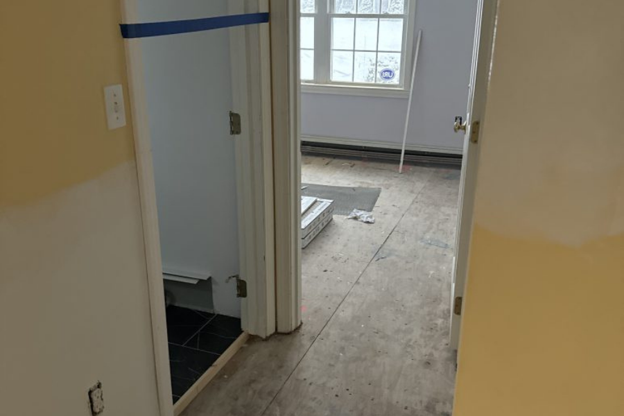 Restoration work in progress on hallway flooring