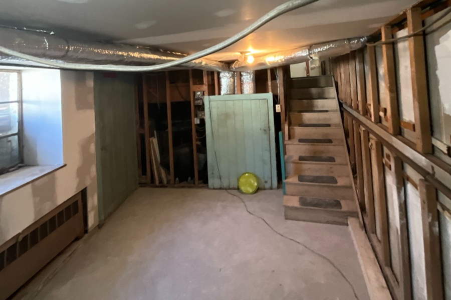 Restored basement with new walls and flooring