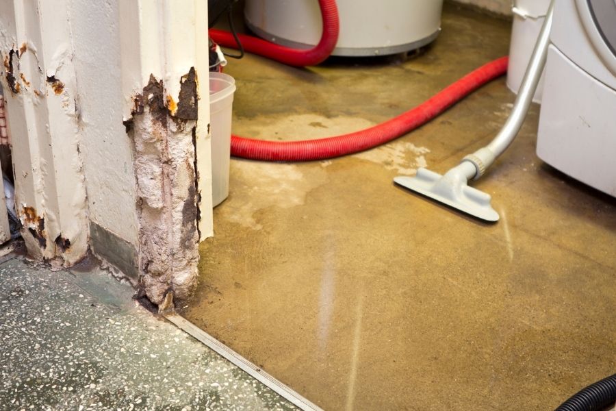 Standing water in a basement after heavy rain in South Shore Massachusetts