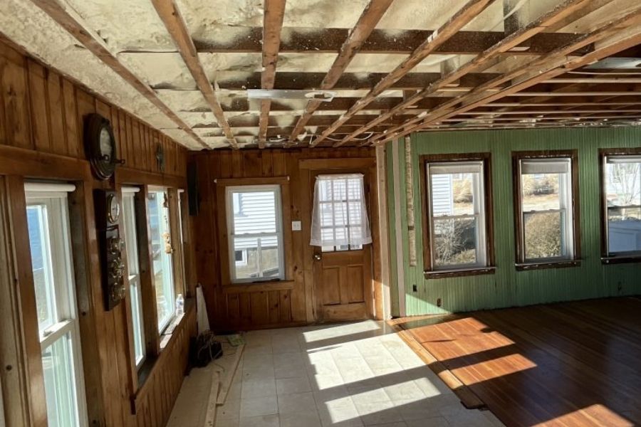 Restoration crew reviewing severe water damage inside a home
