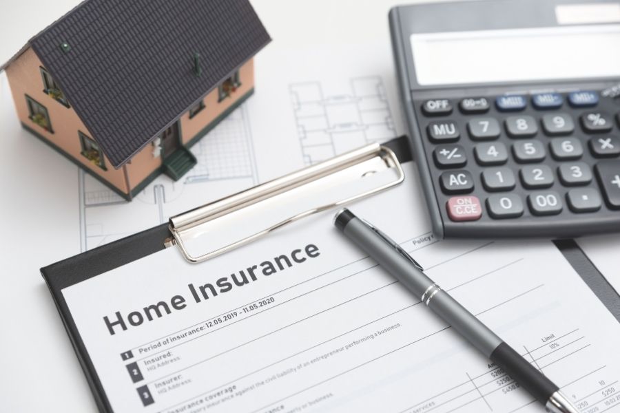 Homeowner reviewing insurance documents and damage photos